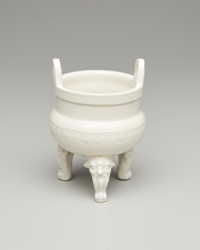China%2C%20Fujian%20province%2C%20Dehua%20kilns%2C%20%3Cb%3E%3Ci%3E%20Incense%20Burner%20in%20the%20Shape%20of%20an%20Archaic%20Tripod%3C%2Fi%3E%3C%2Fb%3E%2C%2019th%20century%2C%20porcelain%20with%20clear%20glaze%3B%20stamped%20character%20for%20shou%20%28longevity%29%20in%20a%20repeating%20band%20around%20waist%3B%20lion%27s%20head-and-paw%20feet%2C%20Gift%20of%20an%20Anonymous%20Donor%2C%20public%20domain%2C%202002.67.3